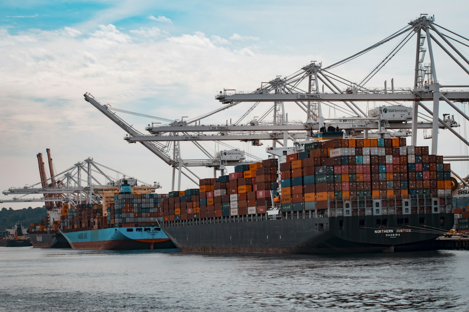 Container ship loading at an Asian port — global sourcing and shipping